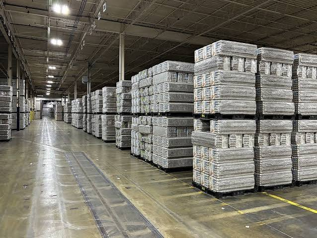 Hartmann warehouse with rows of stacked, wrapped pallets of molded fibre trays